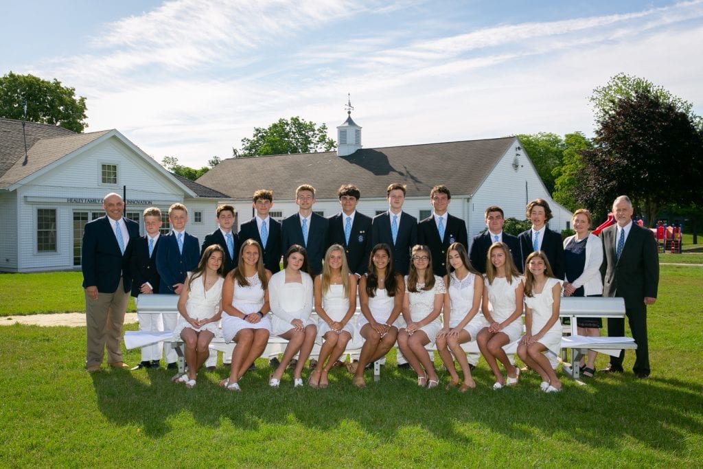 From left, top row: Derby Academy Head of School Joseph J. Perry, Jr. with graduating Grade 8 students from Hingham during Derby Academy’s 228th Derby Day Lecture and Graduation Exercises in Hingham on Wednesday, June 12, 2019: Andrew Cashman, Tyler Cashman, Owen Sharpe, Calder Perry, John Adams, Declan Barao, John Cronin, Tanner Burnett, John Bernatavicius, and Griffin Beaulieu with Head of Middle/Upper Schools Kate Howell and Associate Head of School John Houghton. From left, bottom row: Audrey Born, Ariana Anastos, Amelia Compson, Hilary Morris, Eliza Sadhwani, Elizabeth McDougall, Eliza Farley, Sadie Bartletta, and Sophia Hansen.