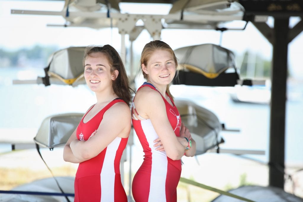 Devon Moriarty (left) and Ella Niehoff rowed continuous on erg machines for 34 hours. (Photo by Joshua Ross Photography)