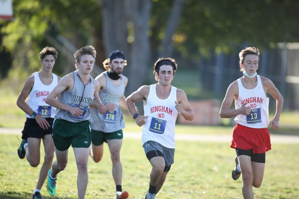 The lead group of runners stayed together the whole way through the race, which included Hingham's Charlie Donahue(12), Steve McDougall (11), and Kevin Ierardi (13).