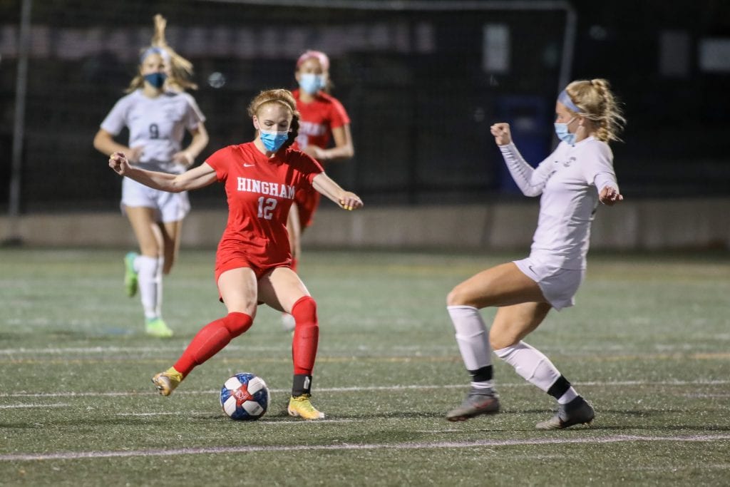 Freshman Claire Murray kicks the ball out of her own end in the first quarter.