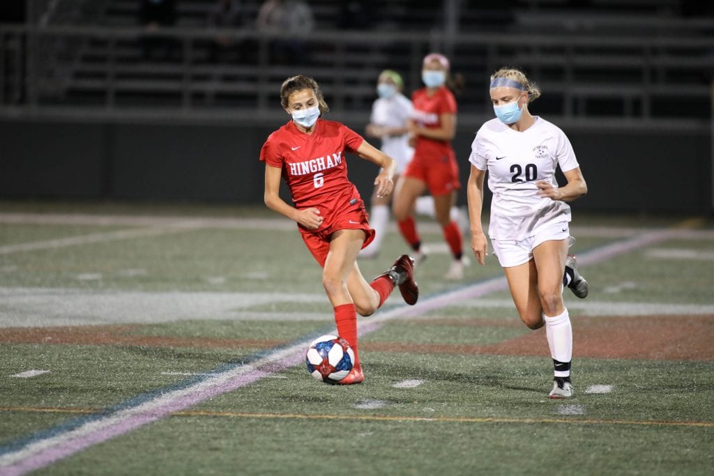 Sophomore defender Maddie Aughe chases down a WH player in the first half. 