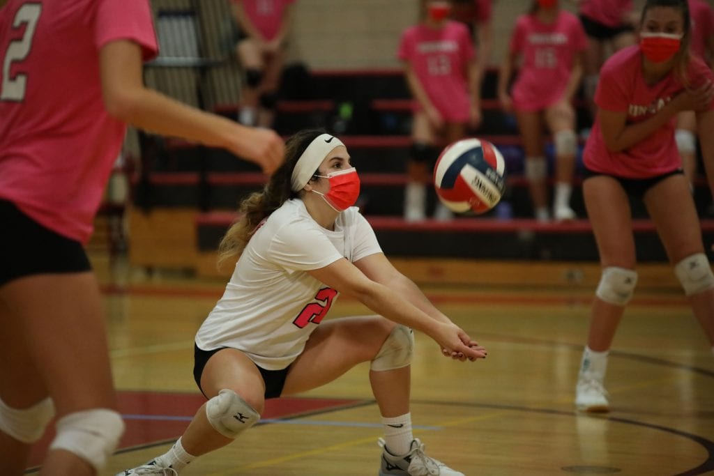 Senior Zoe Bogle sets a teammate off a SL serve. 