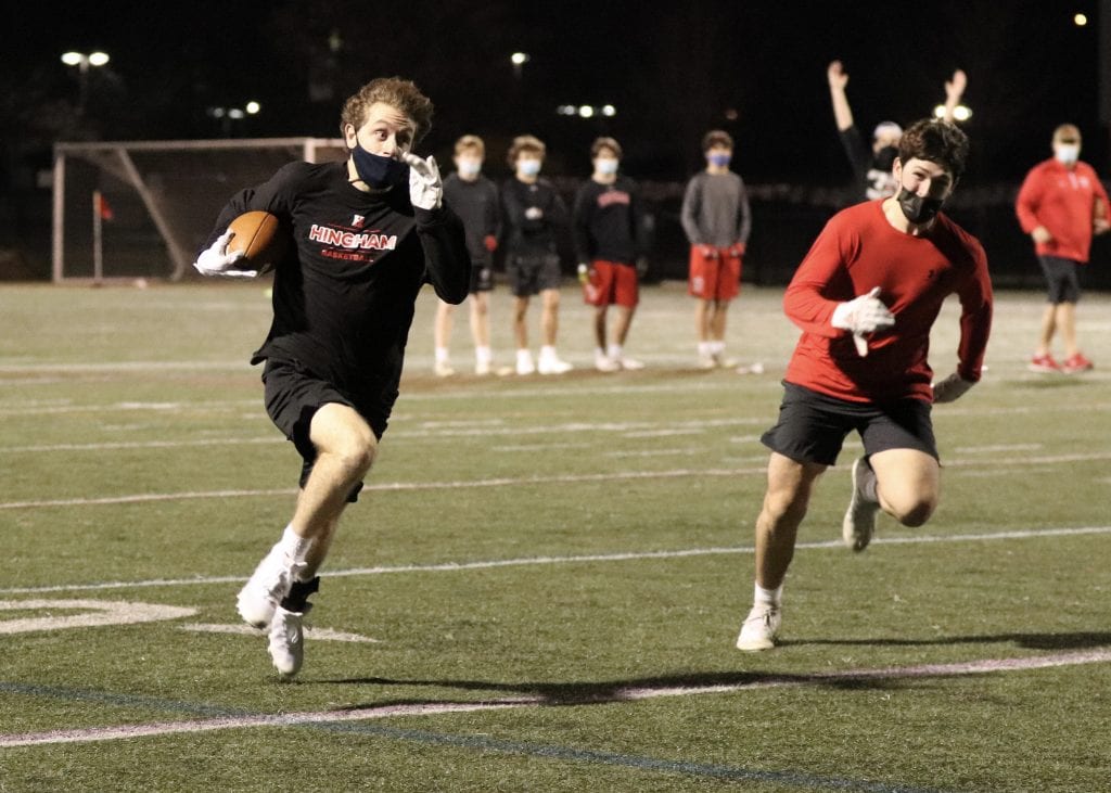 Cooper Estes running down the sideline during the Harbormen's 7v7 showcase.  