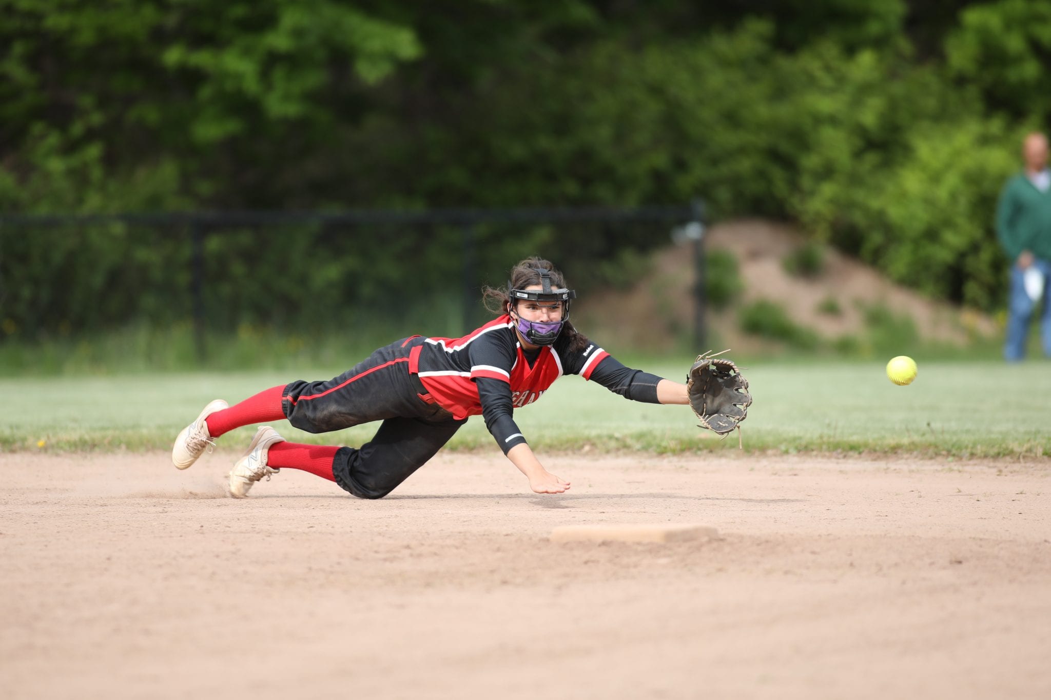 Sophomore Bella Sullivan makes a diving attempt to catch the ball. 