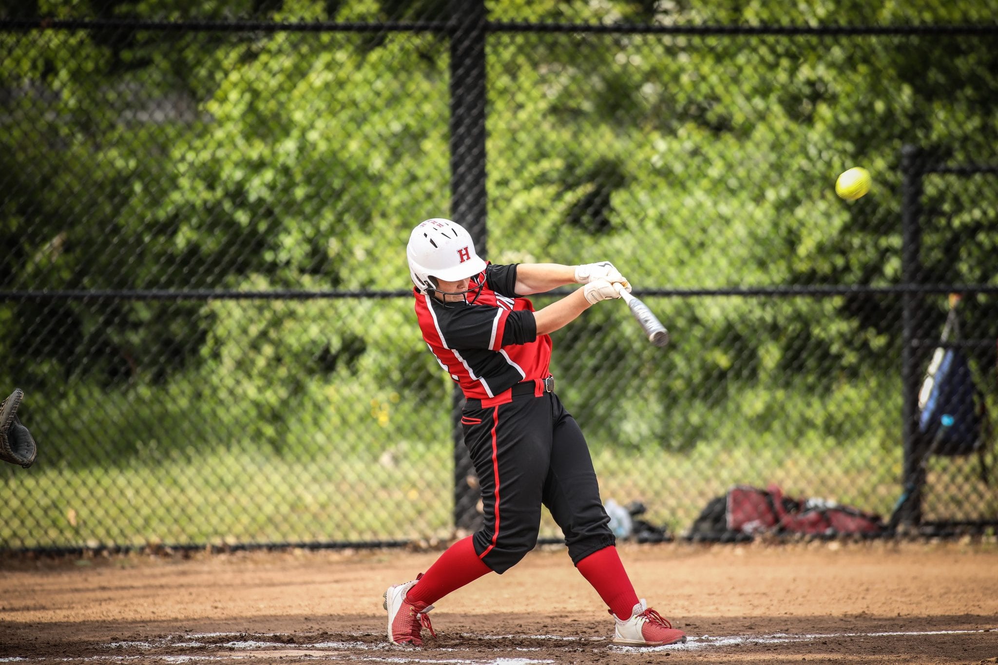 Sophomore Sarah Holler launched this pitch over the centerfield fence for what is believed to be the first grand slam in HHS softball history. 
