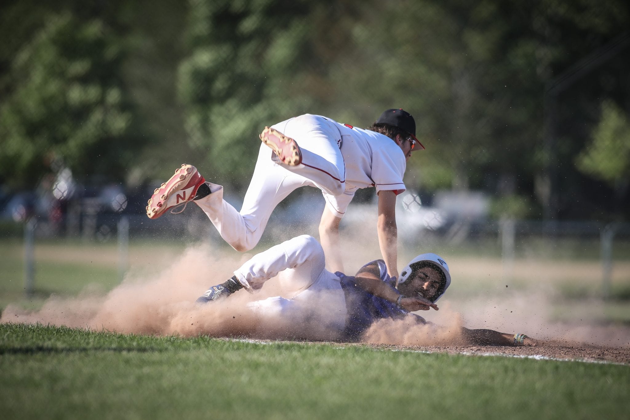 Junior Bobby Falvey avoids the collision after he tags out the runner trying to steal third. 