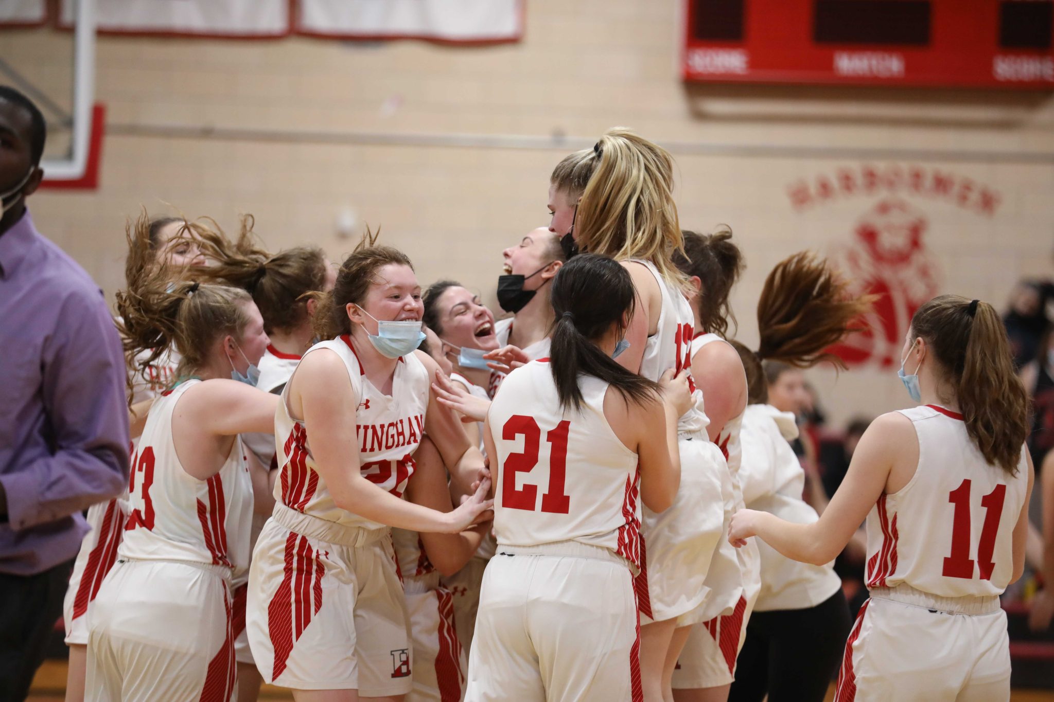 The girls celebrate the huge upset over Whitman-Hanson.