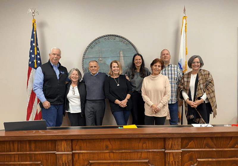 Eight of the eleven members of the 2024 Inaugural Class of the Hingham Local Government Academy posed for a picture at the last LGA session.  